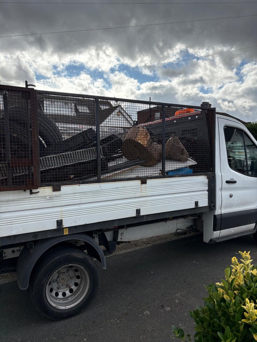 JWL caged tipper loaded with strip-out waste
