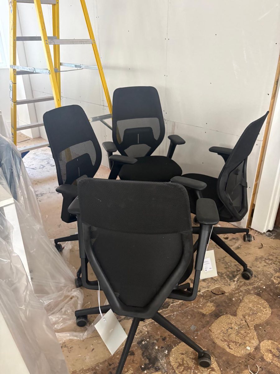 Office chairs gathered for removal during an office clearance