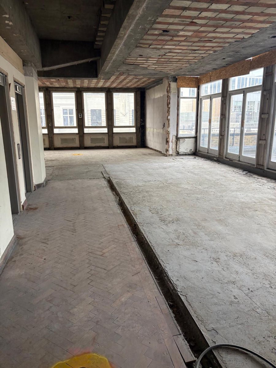 After: Office floor cleared back to the screed