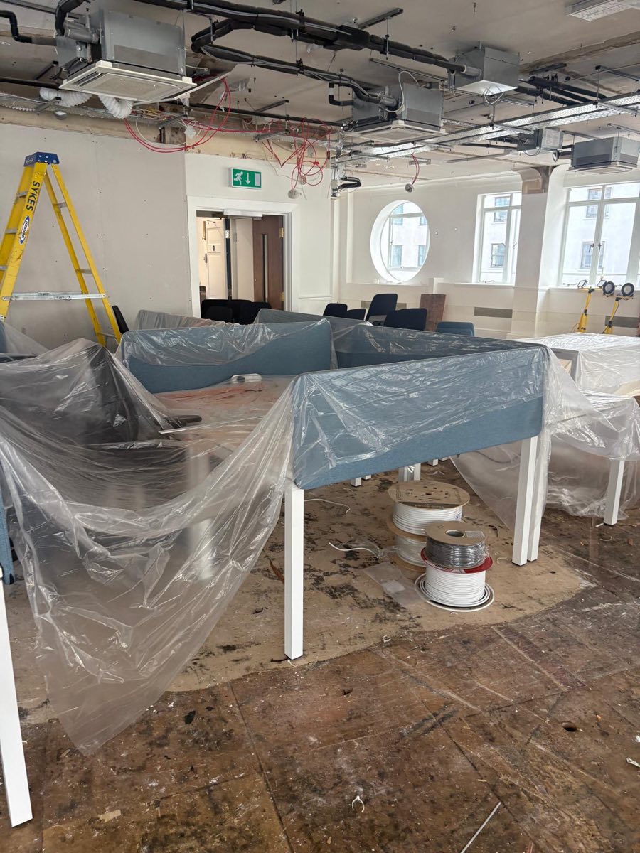 Before: Office floor cleared back to the screed